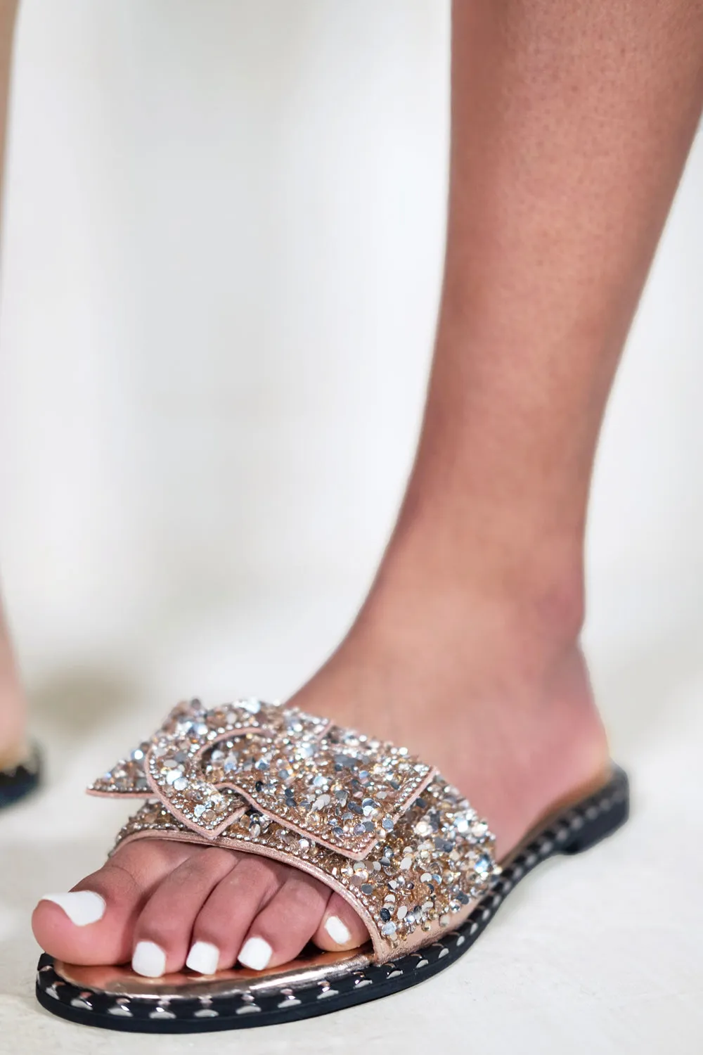 KAMARI DIAMANTE BOW FLAT SLIDERS WITH STUD DETAILS IN ROSE GOLD